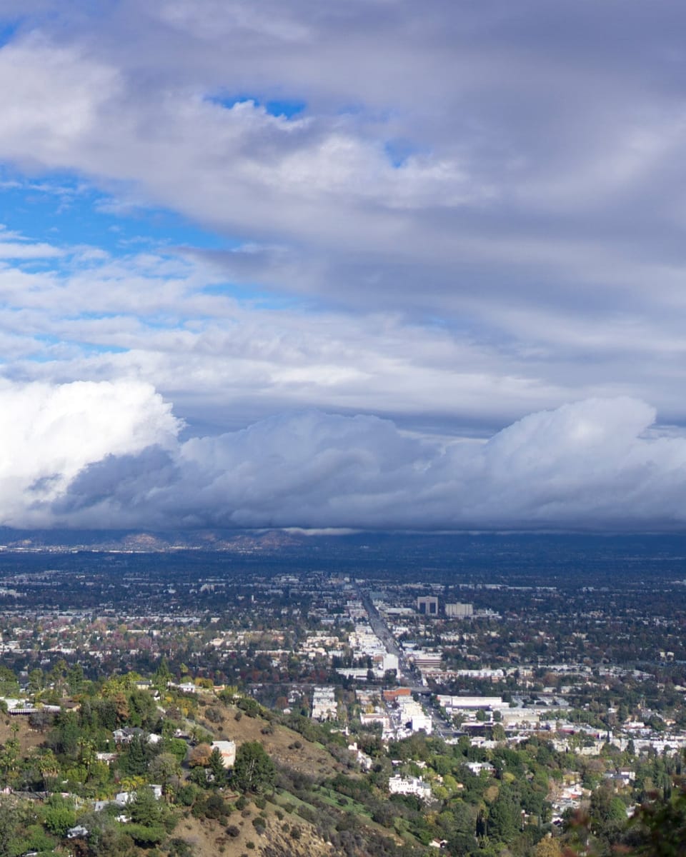 The San Fernando Valley seen from Mulholland Drive under storm clouds
